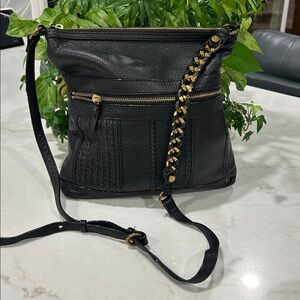 Elliott Lucca Gini flat crossbody bag in‎ black leather antique gold hardware.